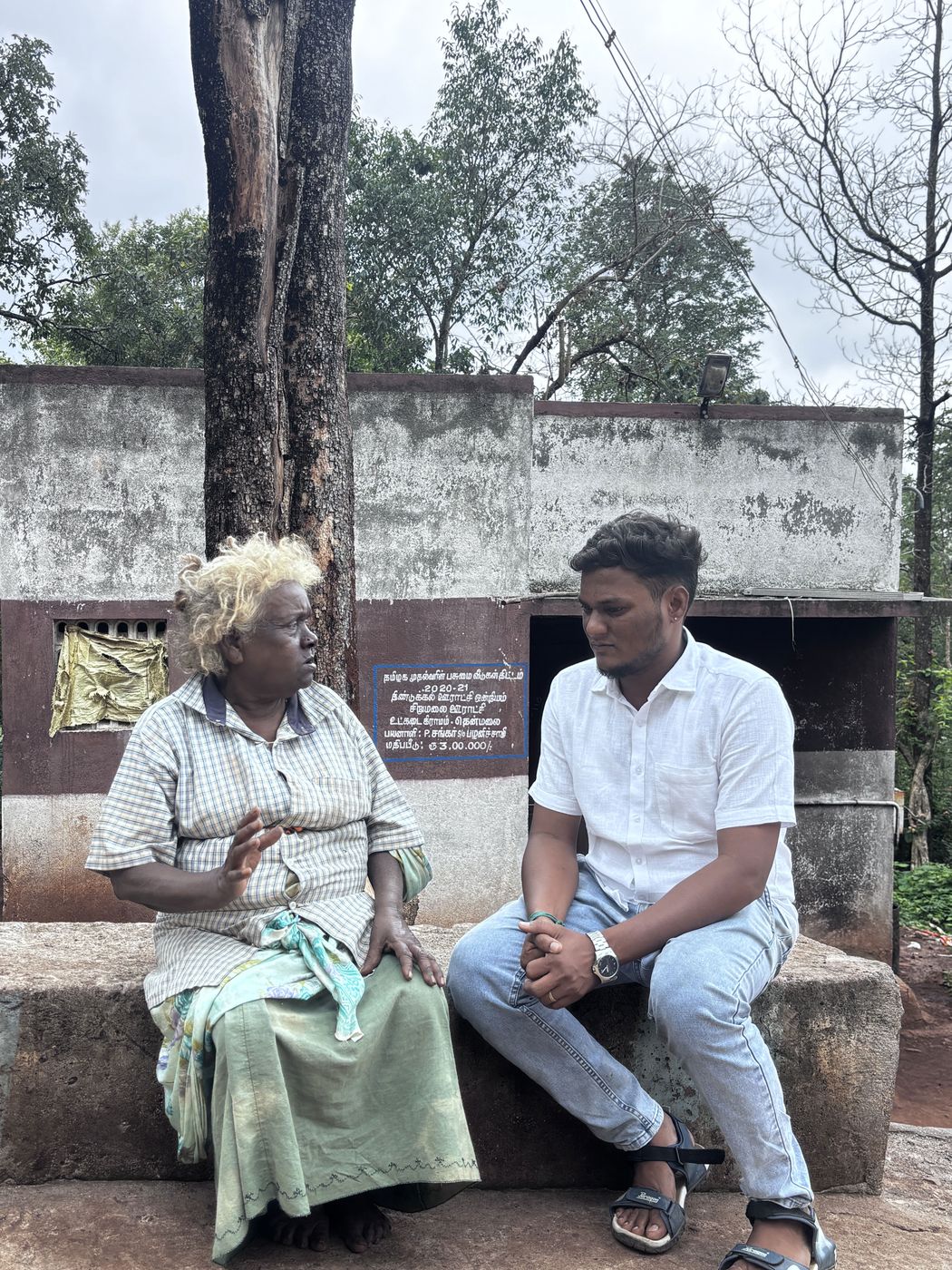 Nilam team member with a village elder